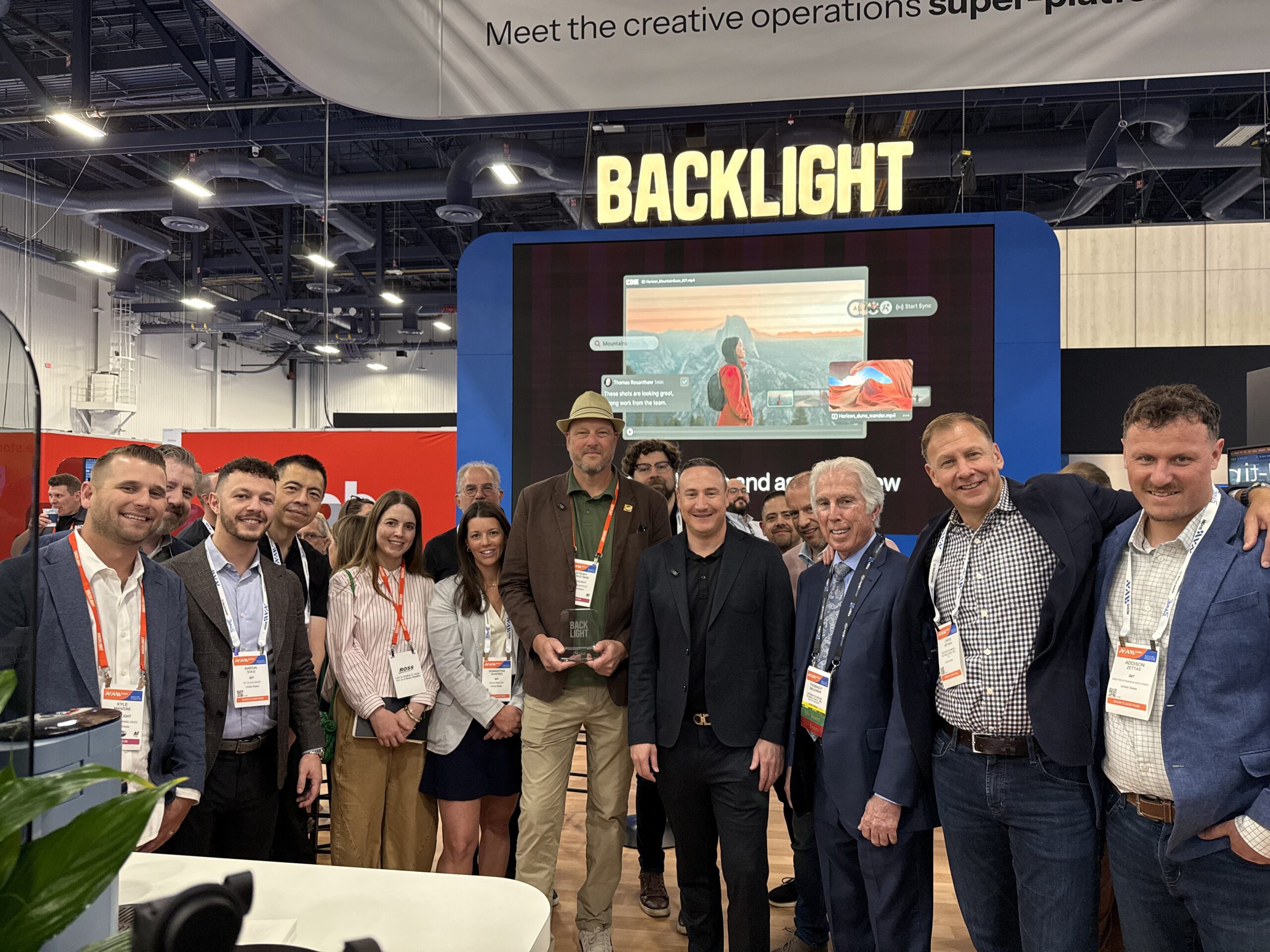 IMT team accepts Backlight's Partner of the Year Americas award for 2026 at NAB Show.